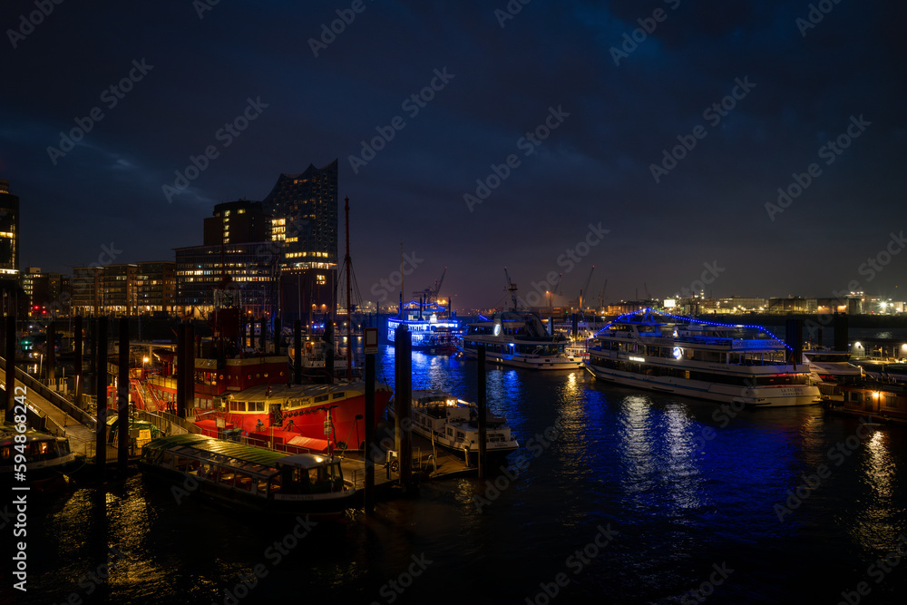 the illuminated port of Hamburg at night