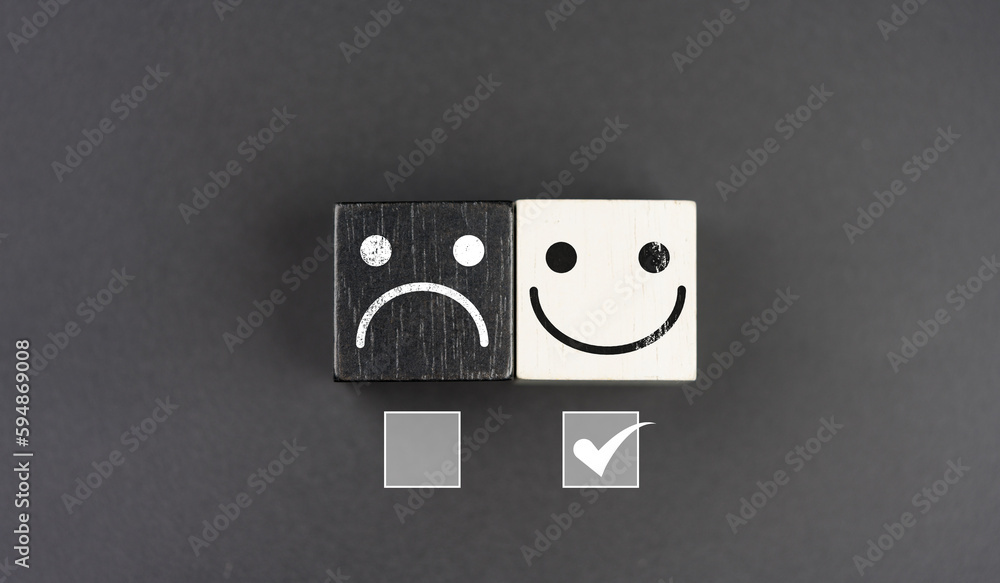 Customer services best excellent business rating experience. Positive reviews. Satisfaction survey. Chooses a smile face on wood block. Face icon on the wood cube block. Choosing a smiling face.