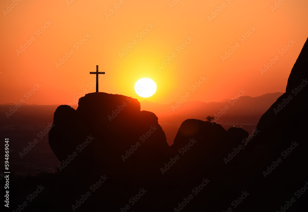 The crucifixion of the crucifixion of jesus christ on the cliffs and mountains. Sunset light. Selective focus.
