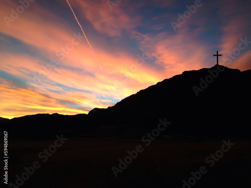 The crucifixion of the crucifixion of jesus christ on the cliffs and mountains. Sunset light. Selective focus.