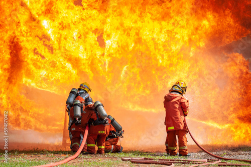 firefighter training new fireman team stop Fire from oil plant blast explode. Fire fighter sprinkle water stop fire burn emergency case at gas station. rescue Care System of Insurance team.