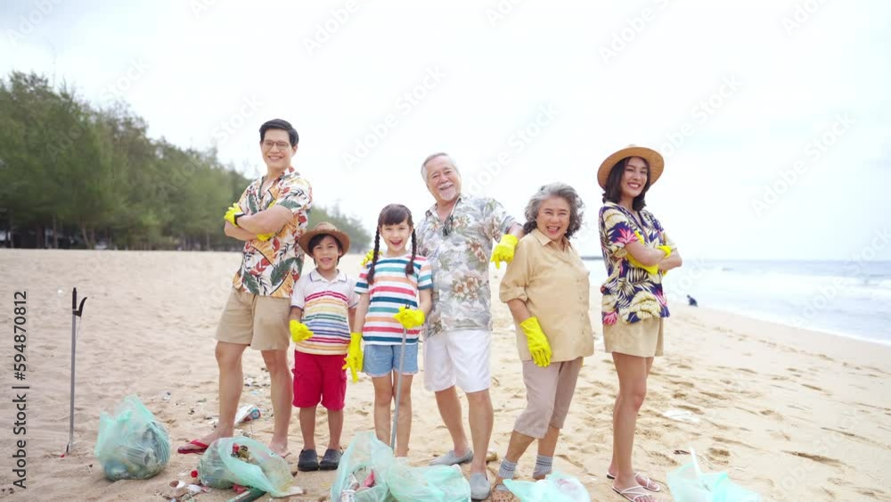 Group of Volunteers multi-Generation family picking up plastic trash ...