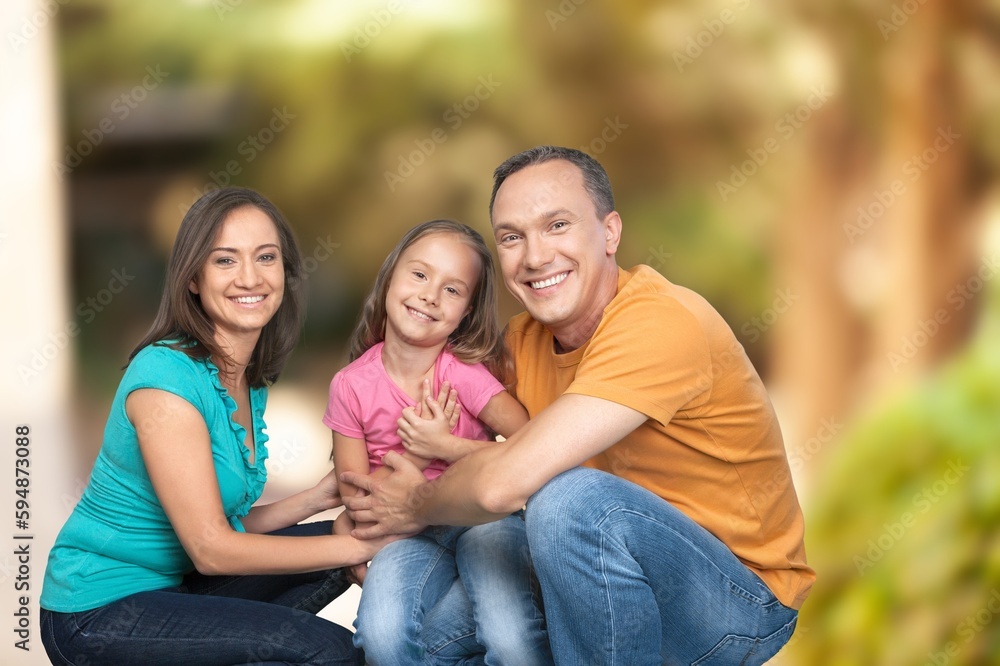 Happy young family have fun in the garden Happy young family have fun in the garden