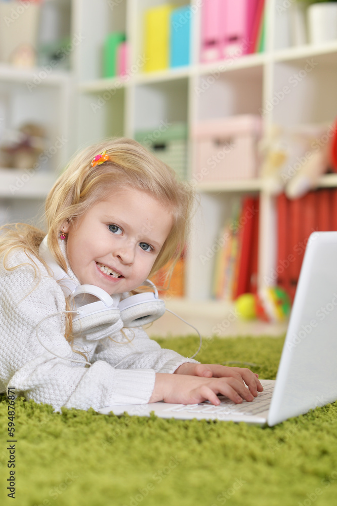 girl with headphones using laptop girl with headphones using laptop