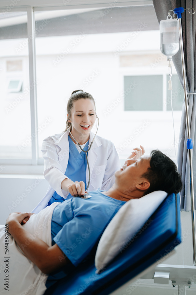 Caucasian doctor smiling take care of a young patient in hospital. Friendly nurse or therapeutic treat client Professional medical service concept. Caucasian doctor smiling take care of a young patient in hospital. Friendly nurse or therapeutic treat client Professional medical service concept.
