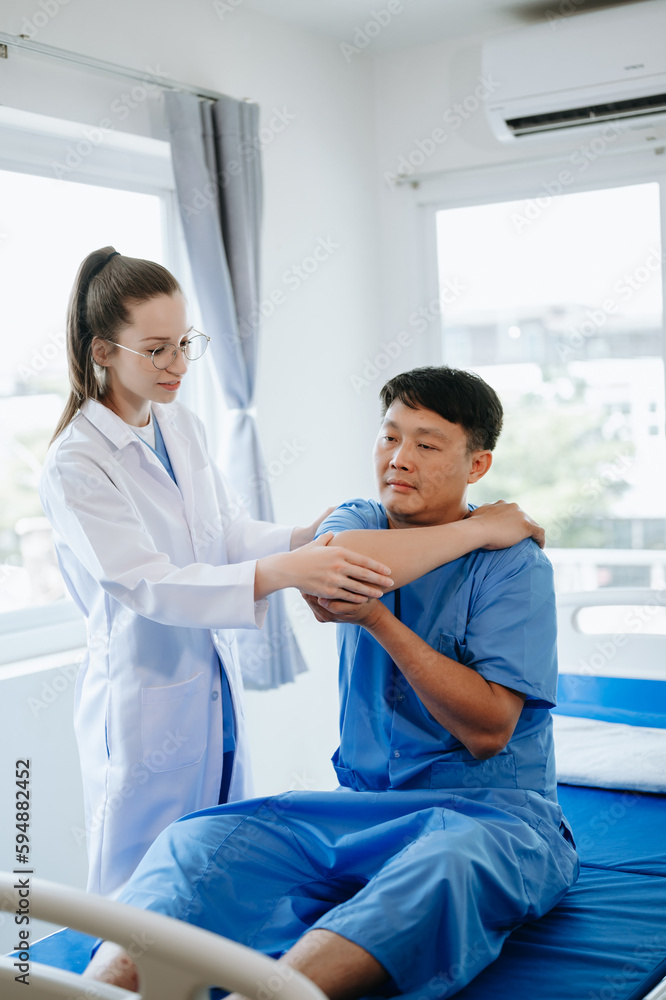 Doctor consulting with patient Back problems Physical on the bed in clinic therapy concept Doctor consulting with patient Back problems Physical on the bed in clinic therapy concept
