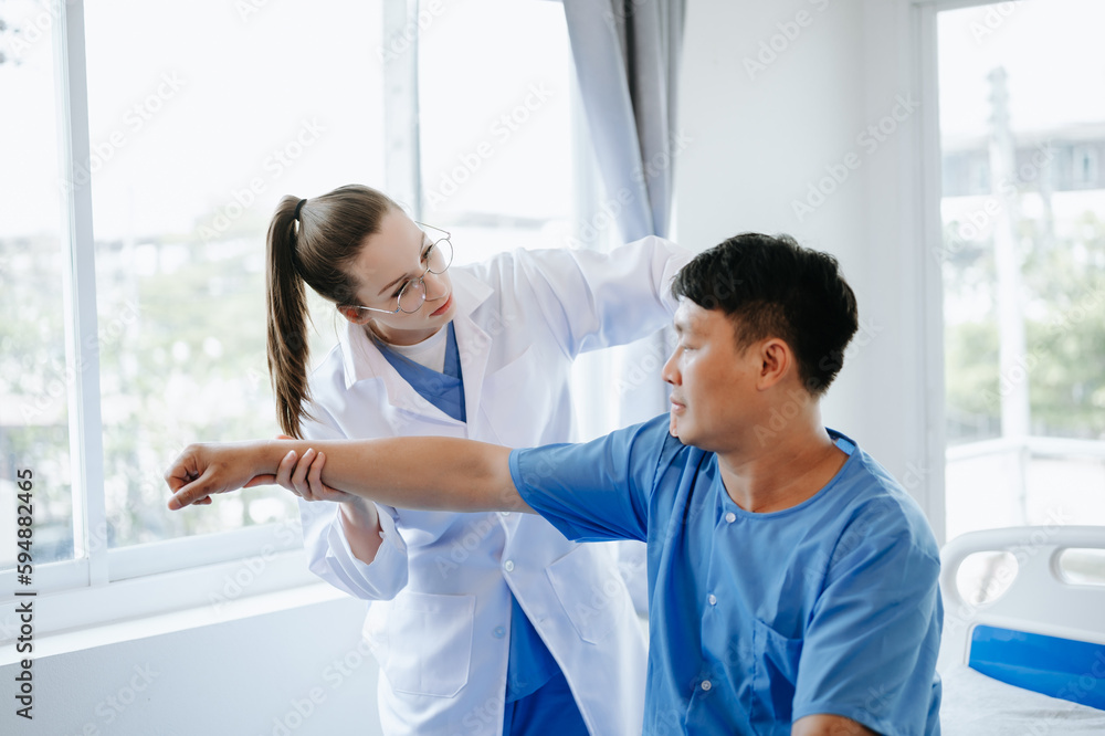 Doctor consulting with patient Back problems Physical on the bed in clinic therapy concept Doctor consulting with patient Back problems Physical on the bed in clinic therapy concept