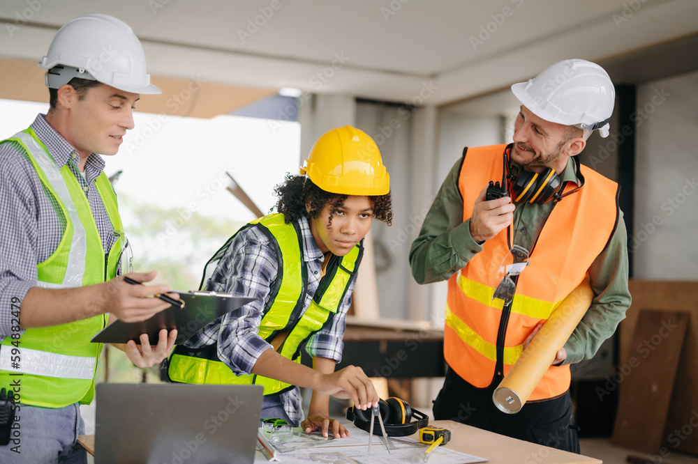 Engineers are discussing data working and laptop or tablet with architectural project at new construction site on big project. Engineers are discussing data working and laptop or tablet with architectural project at new construction site on big project.