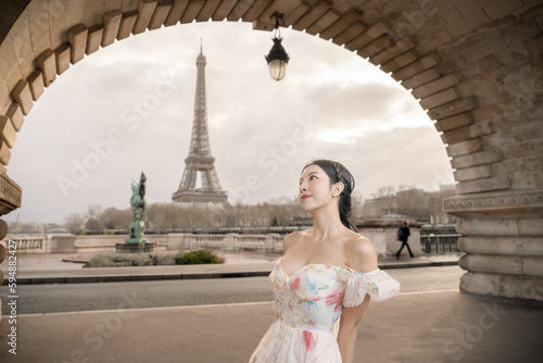 woman portrait under Bir Hakeim bridge with Eiffel tower. Paris, France. photo