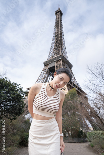 Woman near the Eiffel tower Paris, France. © marchsirawit