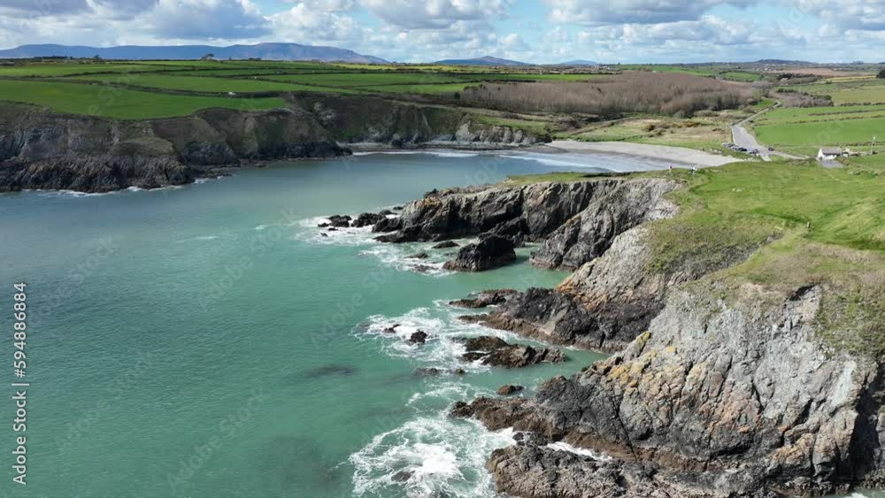 Ireland Waterford Coast torquiese sea and green land Copper Coast Drive early spring Morning Ireland Waterford Coast torquiese sea and green land Copper Coast Drive early spring Morning