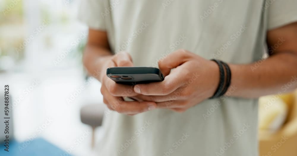 Man, hands and phone typing for social media, communication or chatting in living room at home. Hand of male texting, research or browsing on mobile smartphone app for online chat or networking Man, hands and phone typing for social media, communication or chatting in living room at home. Hand of male texting, research or browsing on mobile smartphone app for online chat or networking