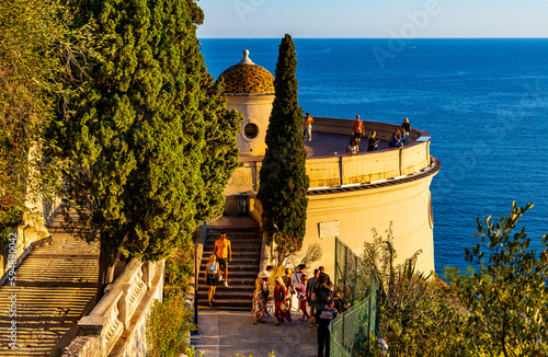 Sunset view of Colline du Chateau Castle Hill and Tour Bellanda Tower in Nice over French Riviera of Mediterranean Sea in France