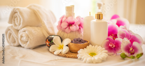 The compress ball spa salt cup  and lotion bottle are key components of a relaxing spa treatment.