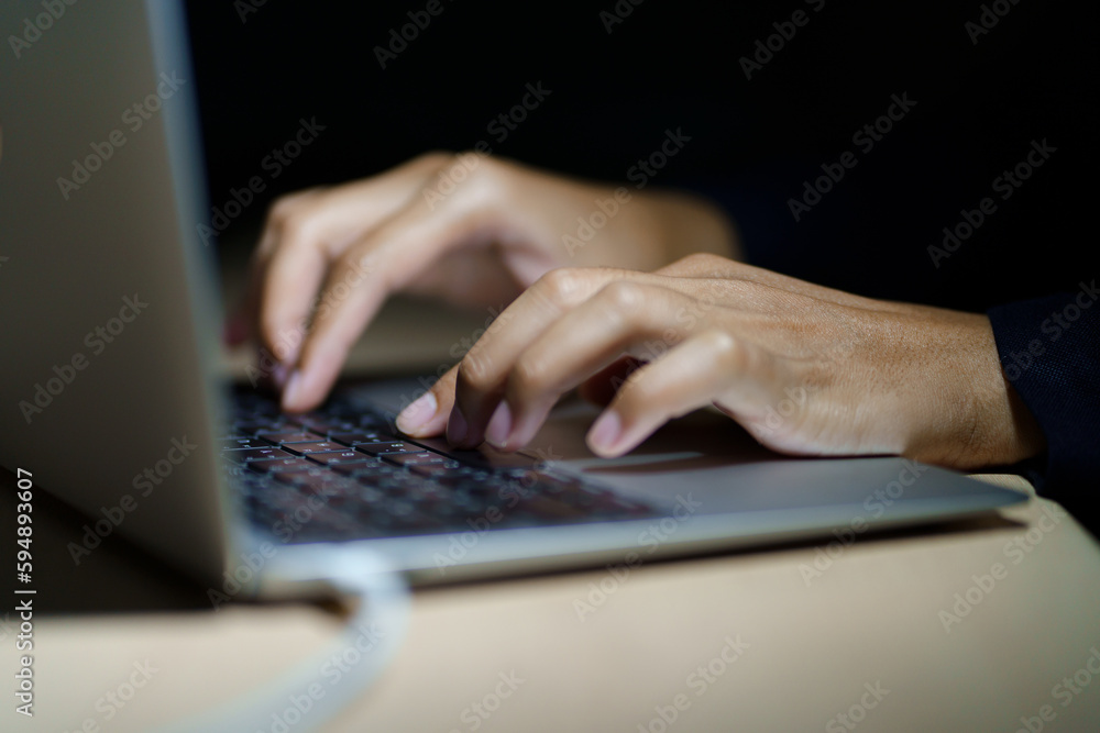 Close up of a man's hands on keyboard of lap top in the dark room, people working at home, modern white notebook. Internet, work, technology concept. Close up of a man's hands on keyboard of lap top in the dark room, people working at home, modern white notebook. Internet, work, technology concept.