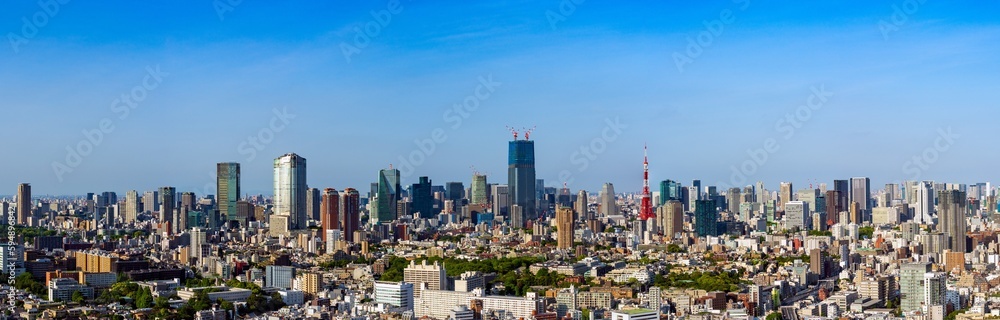 Panoramic view of Tokyo central are with Tokyo tower and office buildings at daytime.	