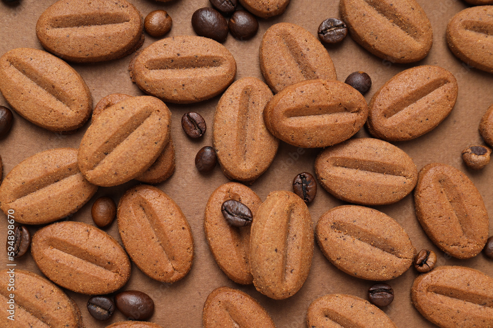 Concept of tasty snack for hot drink - cookies in the shape of coffee seeds Concept of tasty snack for hot drink - cookies in the shape of coffee seeds