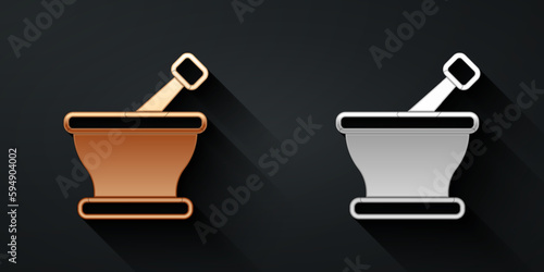 Gold and silver Mortar and pestle icon isolated on black background. Long shadow style. Vector