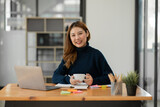 Asian businesswoman holding notebook about business, spending money.