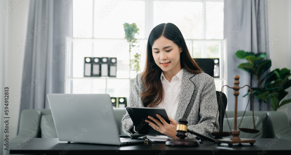 justice and law concept.Female judge in a courtroom on wooden table and Counselor or Female lawyer working in office. justice and law concept.Female judge in a courtroom on wooden table and Counselor or Female lawyer working in office.
