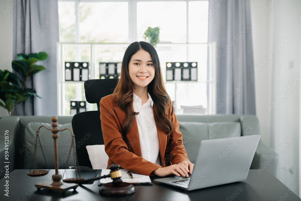 justice and law concept.Female judge in a courtroom on wooden table and Counselor or Female lawyer working in office. justice and law concept.Female judge in a courtroom on wooden table and Counselor or Female lawyer working in office.