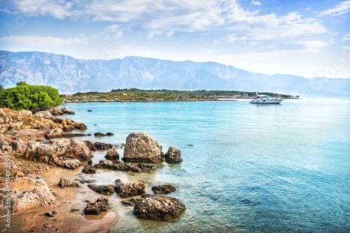 Rocky coast of Cleopatra island and yacht  Aegean sea  Marmaris  T  rkiye