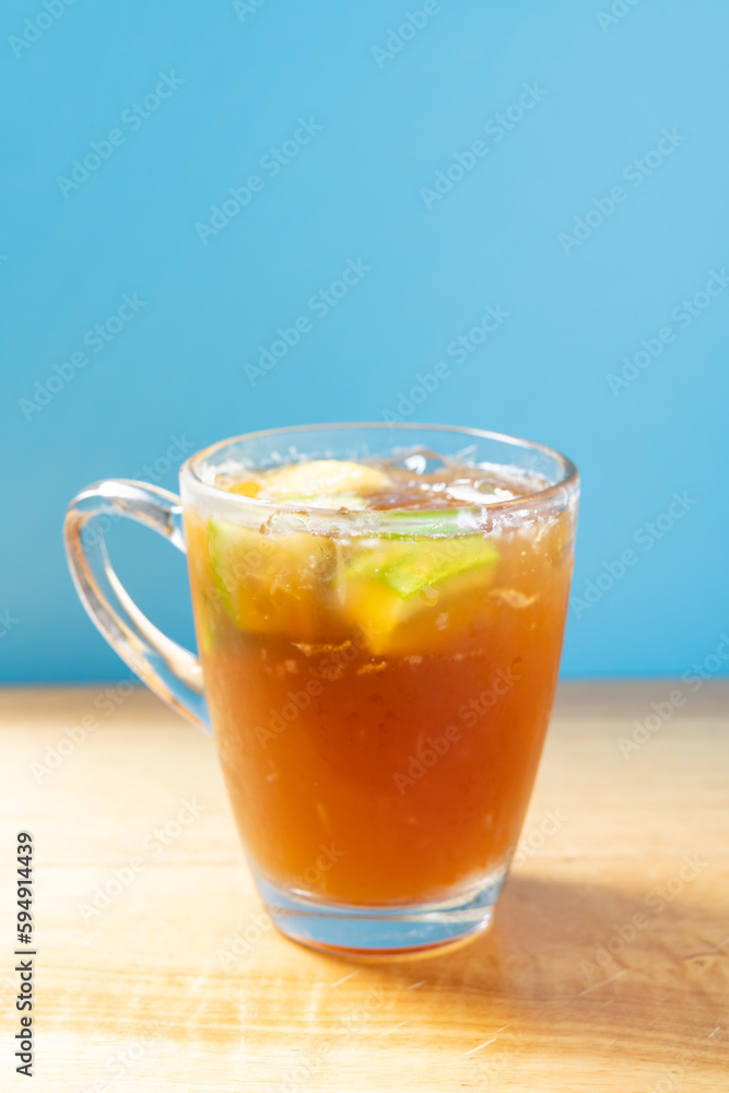 side view glass cup of iced lemon vertical composition side view glass cup of iced lemon vertical composition