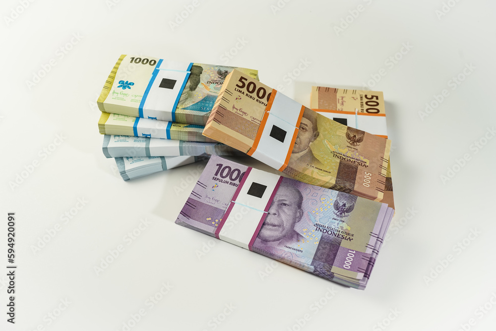 Jakarta, Indonesia, April 15, 2023, various bundles of Indonesian rupiah banknotes in the IDR currency thousands copy space thr zakat Jakarta, Indonesia, April 15, 2023, various bundles of Indonesian rupiah banknotes in the IDR currency thousands copy space thr zakat