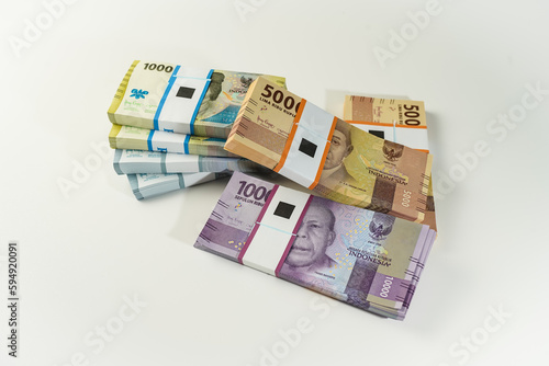Jakarta, Indonesia, April 15, 2023, various bundles of Indonesian rupiah banknotes in the IDR currency thousands copy space thr zakat