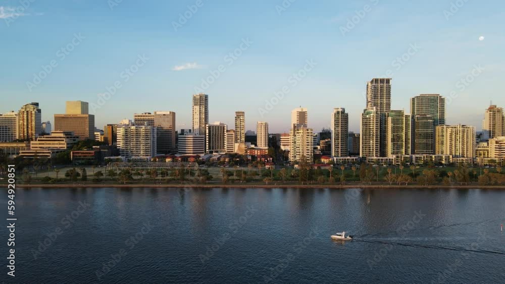 Drone shot of City of Perth foreshore from the river with Moon in shot Drone shot of City of Perth foreshore from the river with Moon in shot