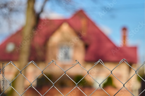 protected house behind a wire fence. High quality photo