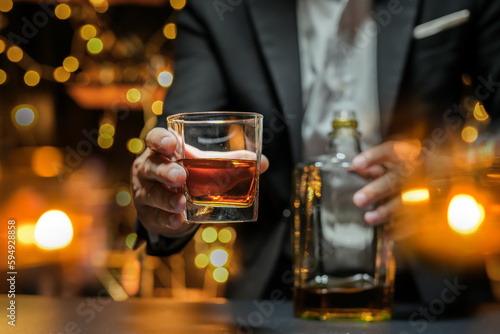 Bartender Serve Whiskey  on wood bar  