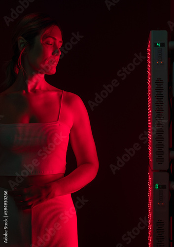 Woman getting red light therapy in a beauty spa