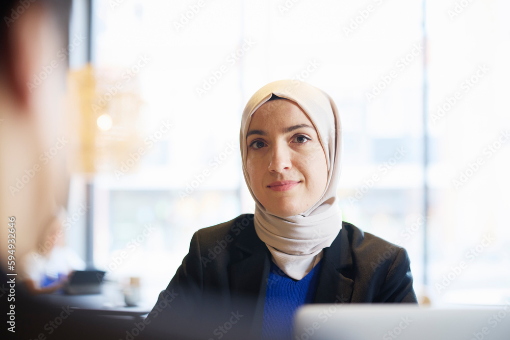 © Johnér - Woman in headscarf sitting in cafe © Johnér - Woman in headscarf sitting in cafe