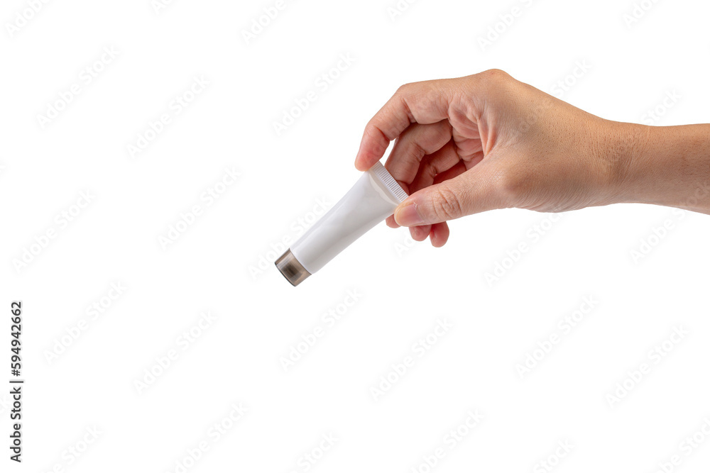 Female hand holds cosmetic product in tube, bottle, lotion or serum on transparent background. Female hand holds cosmetic product in tube, bottle, lotion or serum on transparent background.