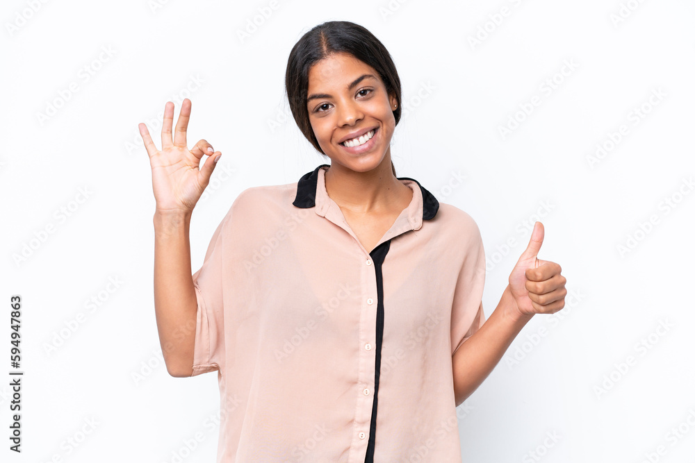 Young African american woman isolated on white background showing ok sign and thumb up gesture Young African american woman isolated on white background showing ok sign and thumb up gesture