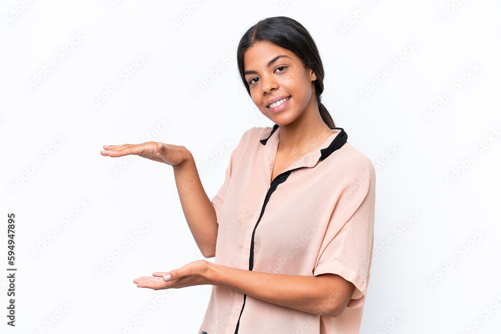 Young African american woman isolated on white background holding copyspace to insert an ad Young African american woman isolated on white background holding copyspace to insert an ad