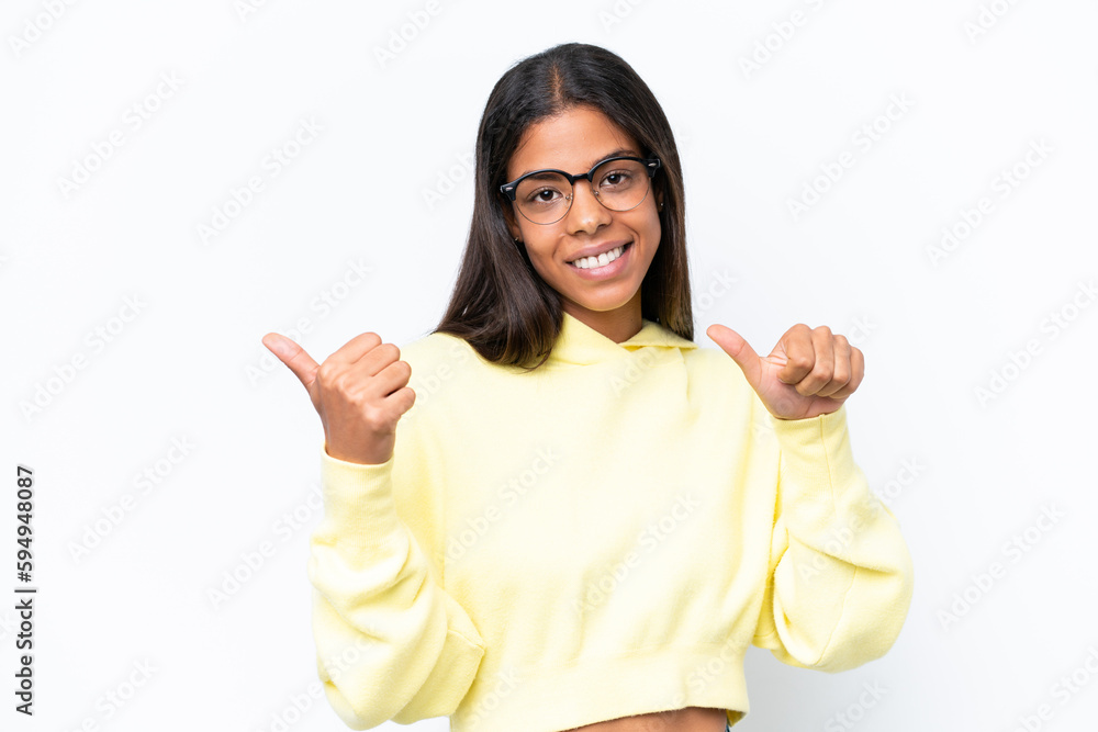 Young African american woman isolated on white background pointing to the side to present a product Young African american woman isolated on white background pointing to the side to present a product
