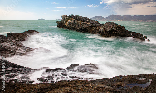 Waves flowing around the coastal sea rocks © Mathias Pabst