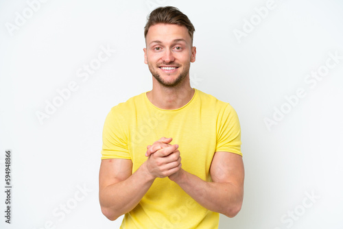 Young blonde caucasian man isolated on white background laughing