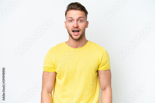 Young blonde caucasian man isolated on white background with surprise facial expression