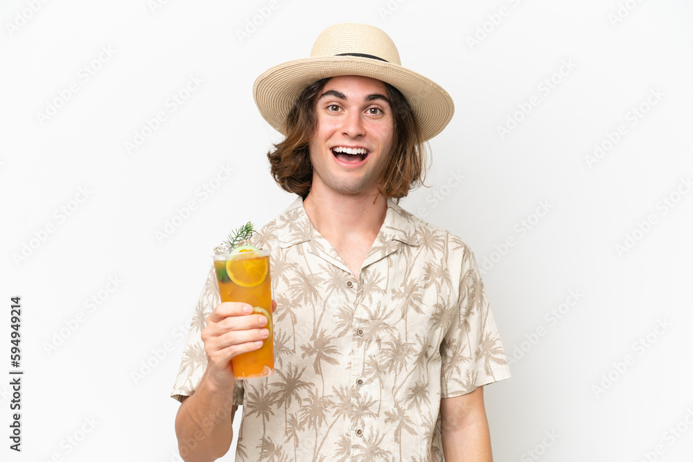Young handsome man holding a cocktail isolated on white background with surprise facial expression Young handsome man holding a cocktail isolated on white background with surprise facial expression
