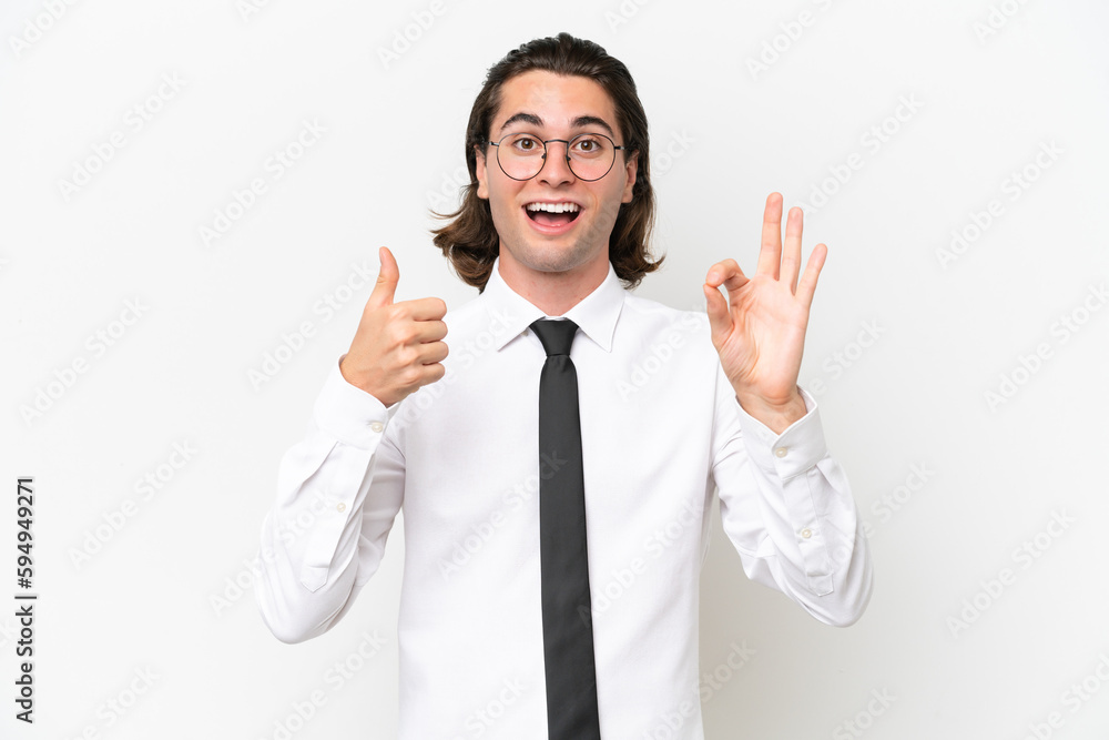 Business handsome man isolated on white background showing ok sign and thumb up gesture Business handsome man isolated on white background showing ok sign and thumb up gesture