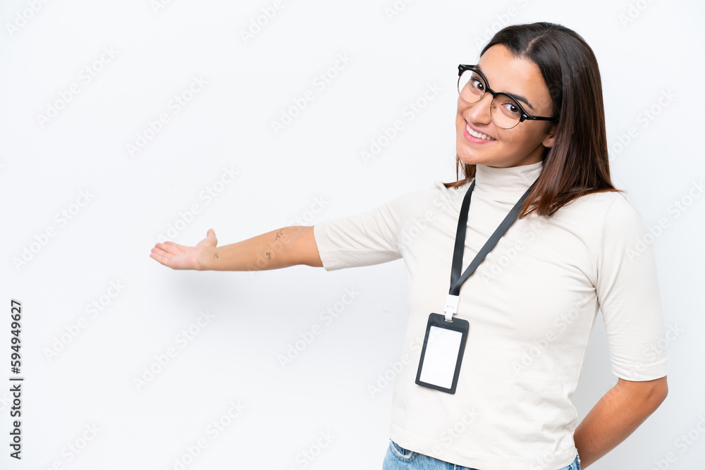Young caucasian woman with ID card isolated on white background extending hands to the side for inviting to come Young caucasian woman with ID card isolated on white background extending hands to the side for inviting to come