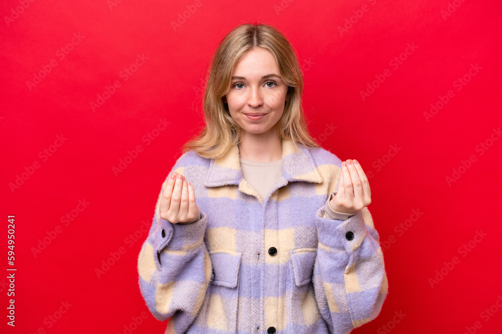 Young English woman isolated on red background making money gesture but is ruined Young English woman isolated on red background making money gesture but is ruined