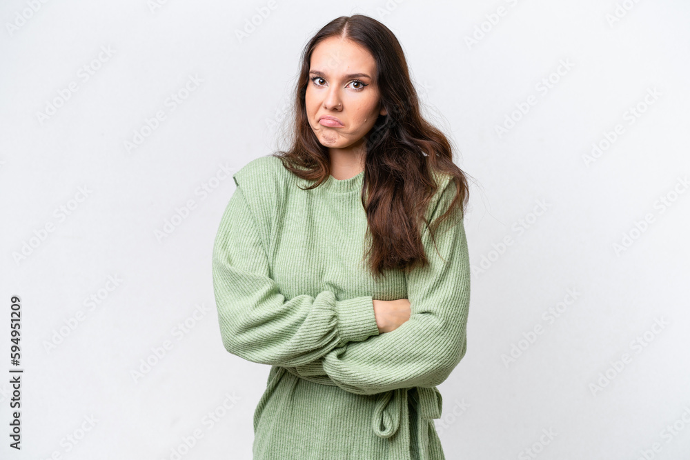 Young caucasian woman isolated on white background making doubts gesture while lifting the shoulders Young caucasian woman isolated on white background making doubts gesture while lifting the shoulders