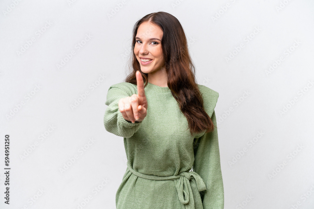 Young caucasian woman isolated on white background showing and lifting a finger Young caucasian woman isolated on white background showing and lifting a finger