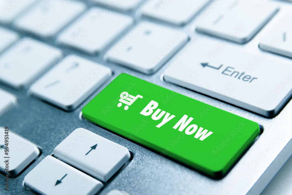 Buy Now button on keyboard with a cart symbol for online shopping Buy Now button on keyboard with a cart symbol for online shopping