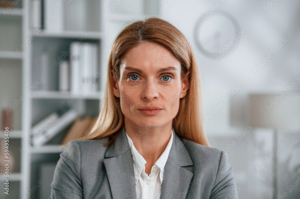 Portrait of woman in business formal clothes that is in the office Portrait of woman in business formal clothes that is in the office