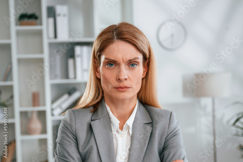 Portrait of woman in business formal clothes that is in the office